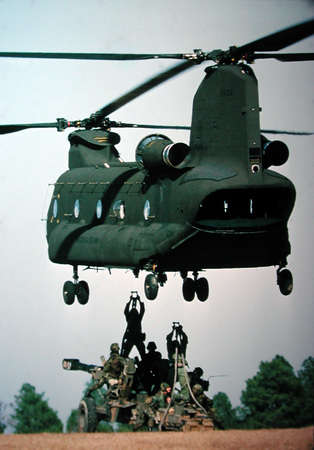 "Hold it right there"--Army CH-47 picking up a "155"--Ft. Bragg